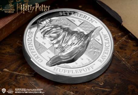 This commemorative has been struck from 2oz of Silver and features the Harry Potter Sorting Hat - who puts students into their houses - in ultra high relief on both sides.
