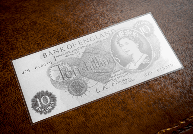 Ten Shillings Silver Banknote Front On Desk