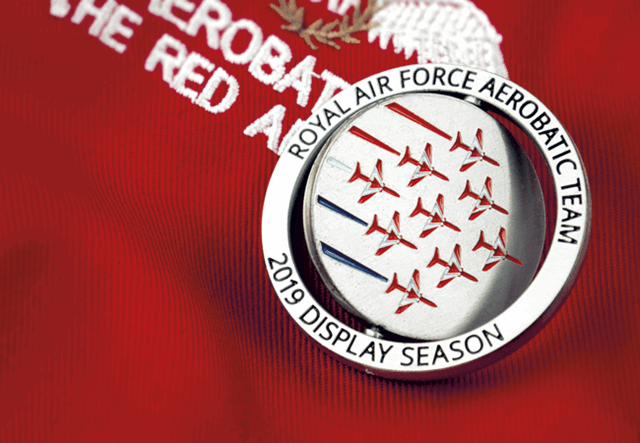 Red Arrows Spinning Medal red background