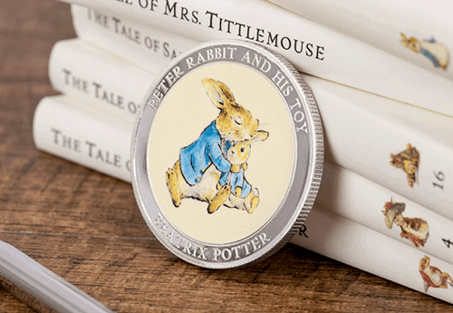 Peter Rabbit - My First Medal leaning against book spines