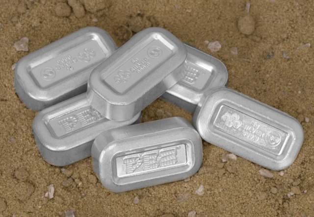 Silver Pez on Sand Background