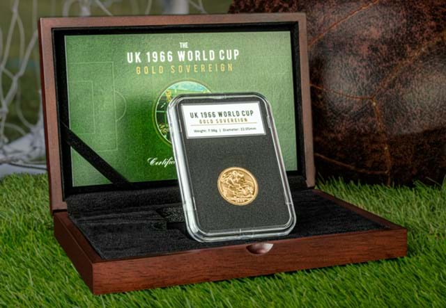 The UK 1966 Gold Sovereign in display case on grass