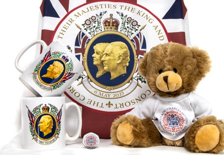 A bundle of memorabilia issued to celebrate the Coronation of King Charles III. Includes Teddy, mug, tea towel and commemorative.