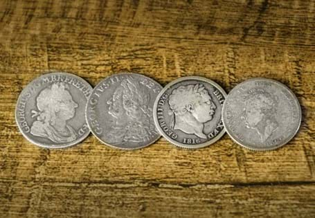 This 4-coin set houses the Silver Shillings issued during the reigns of King George I, George II, George III, and George IV